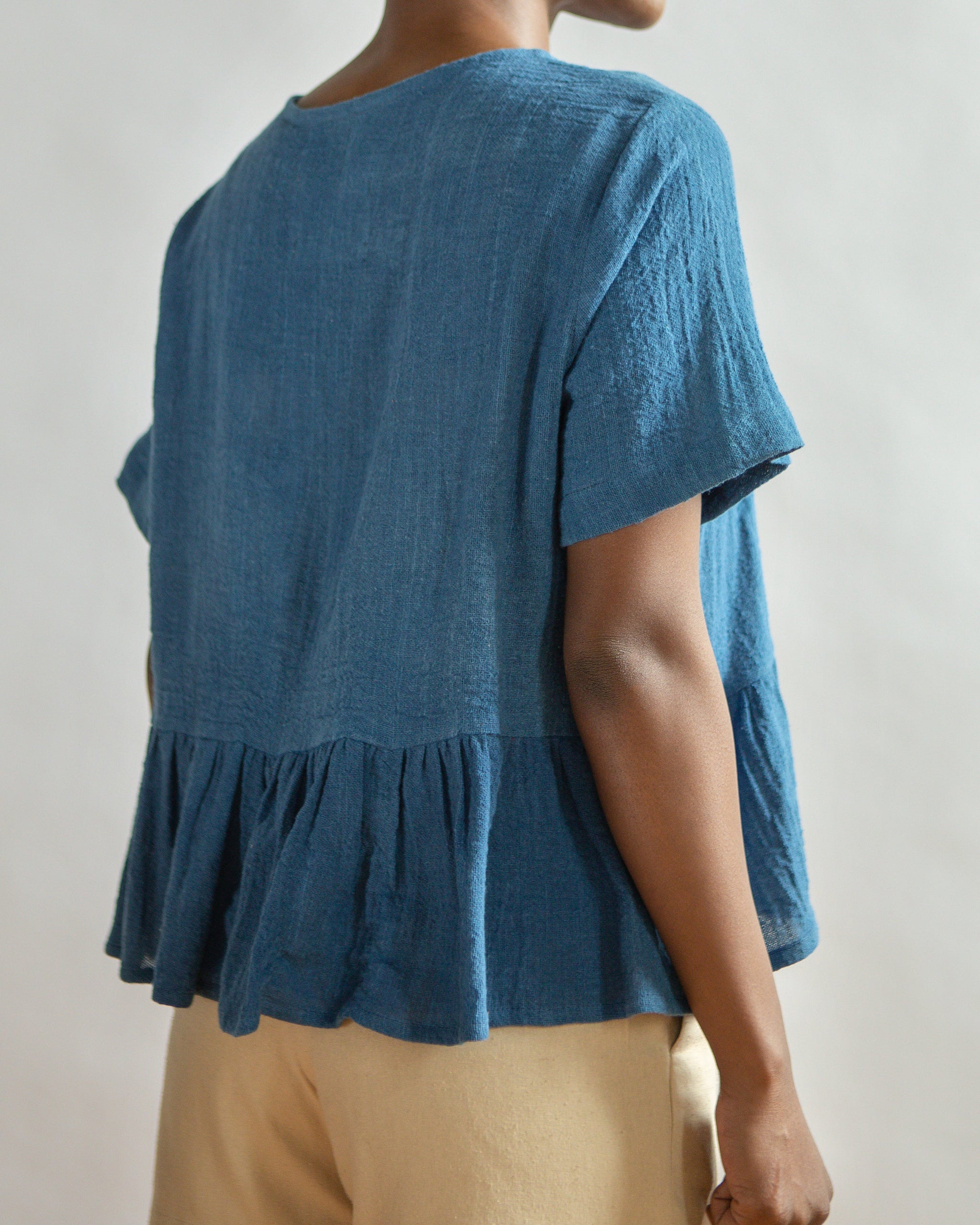 THE INDIGO OMBRE PEPLUM TOP